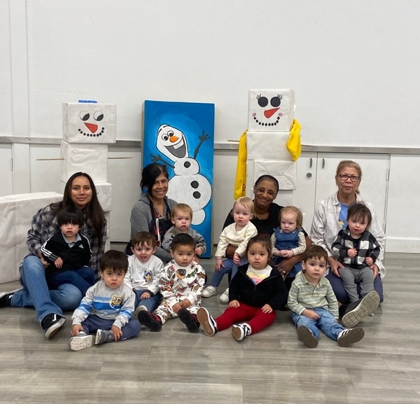 Toddler with snowman